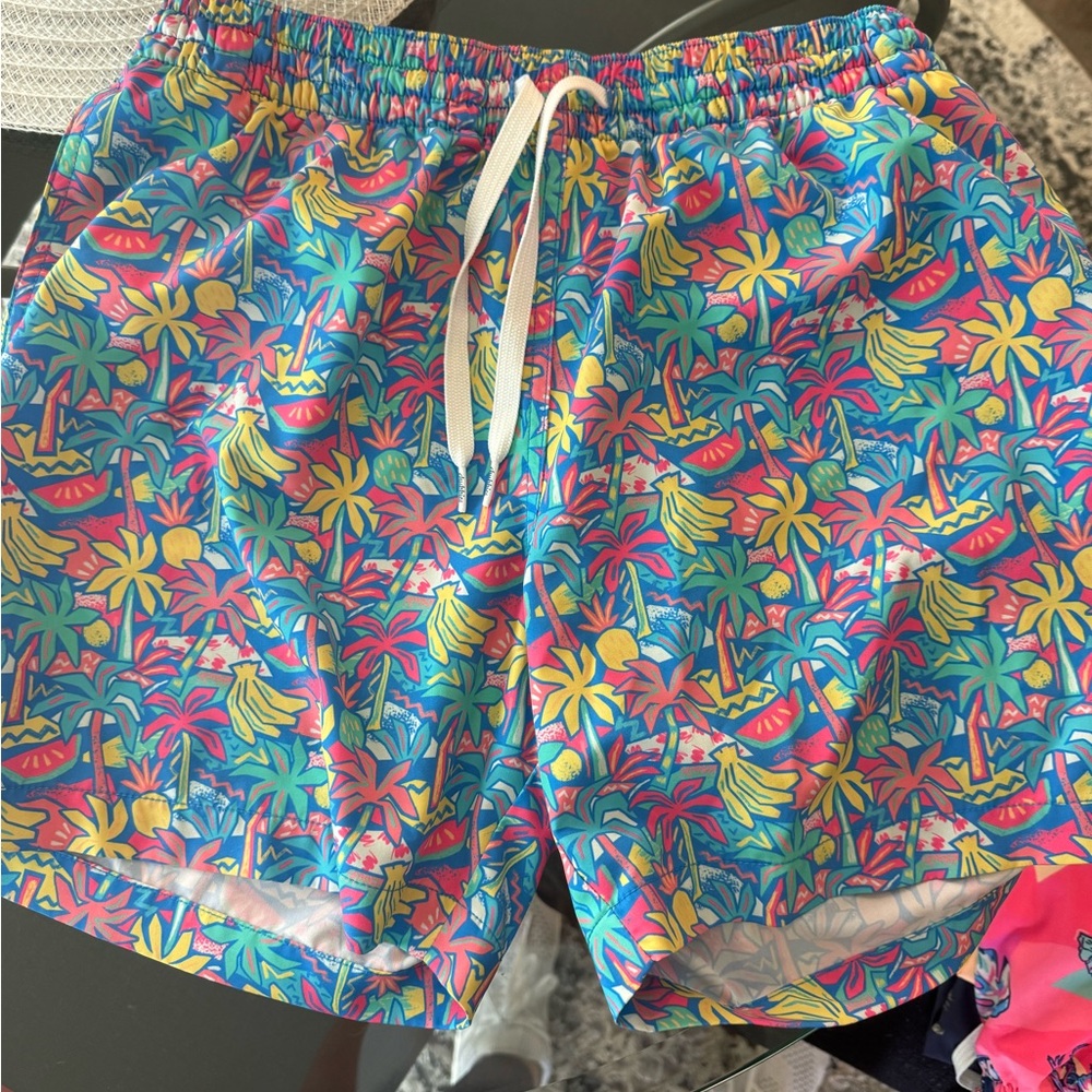 chubbies Tropical Print Swim Trunks in Blue, Yellow, Pink, Green